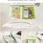 White drawer-style fridge storage rack with rounded pull handles inside an appliance