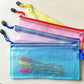 Zipped plastic mesh stationery pouches in blue, pink, and yellow tones