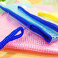 Close-up of plastic mesh stationery pouch with blue zipper pull and track
