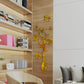 Gold vase-style mirror wall sticker with blossoms and curling stem details