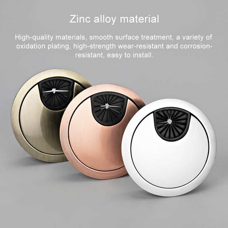 Round zinc alloy desk hole cover with black vent insert on metallic finishes