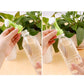 Handheld spray nozzle attaching to a clear bottle for watering potted plants