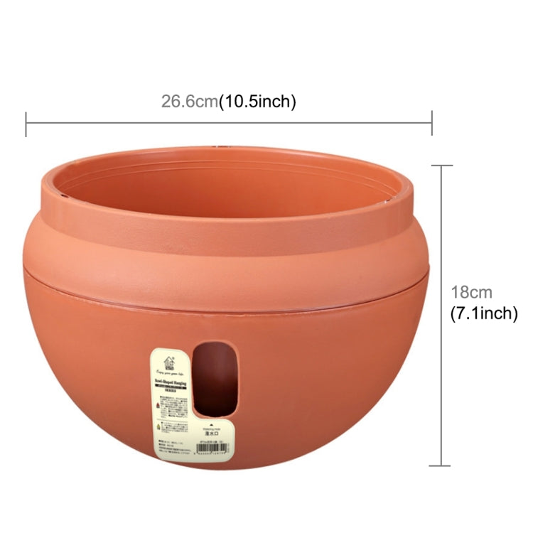 Large orange plastic flower pot, round planter with side drainage opening