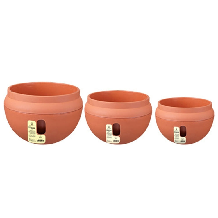 Three orange round plastic flower pots in different sizes, each with side drainage cutout