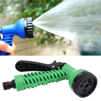 Blue garden water spray gun with adjustable metal ring nozzle, producing a wide spray