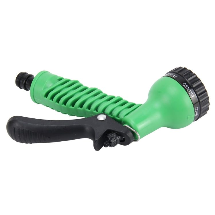 Green garden water spray gun with black lever handle and ridged grip, side view
