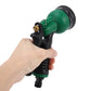 Handheld view of green and black garden spray gun with metal hose connection