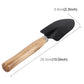 Mini garden spade with black metal blade and light wood handle, about 10 in long
