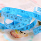 Blue 1.5m soft tape measure with inch and centimeter markings, looped