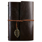 Leather-look travel diary notebook with dark brown leaf embossed cover and brown wrap strap