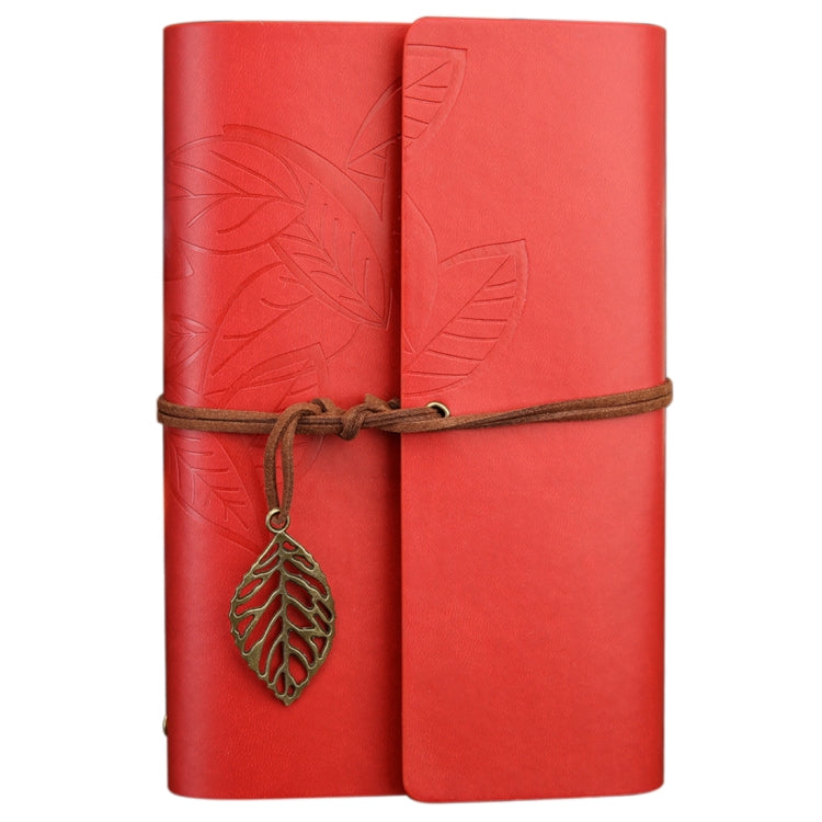 Red loose-leaf travel diary notebook with embossed leaf pattern, leather strap and hanging leaf charm