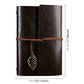 Brown faux-leather travel diary notebook with embossed leaves, leather strap, hanging leaf charm