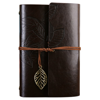 Brown faux-leather travel diary notebook with embossed leaf cover and leaf charm clasp