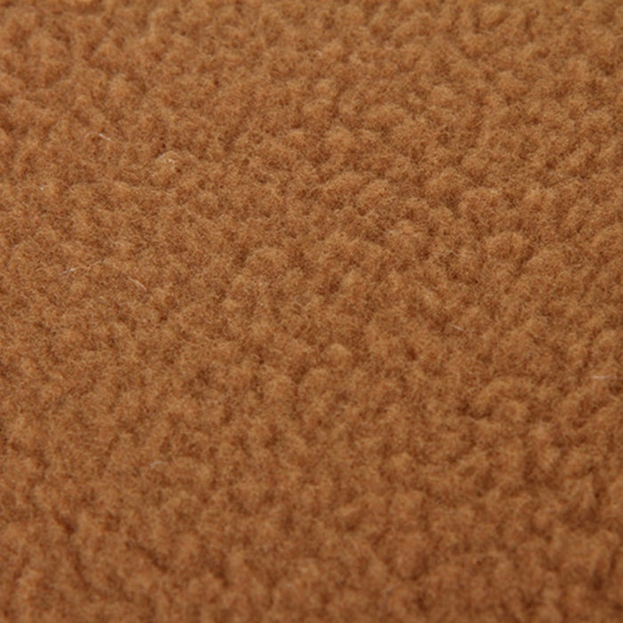 Slipper-shaped fleece pet house bed fabric, tan/brown plush texture close-up