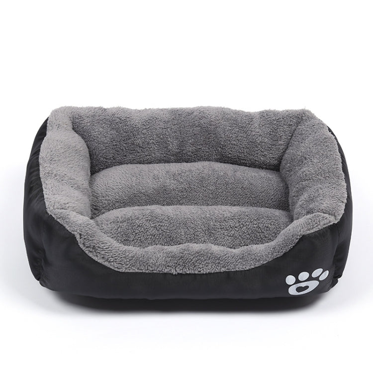 Gray plush and black pet kennel mat with paw-print emblem on the side
