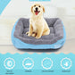 Light blue and gray pet kennel mat with paw emblem, shown with a sitting golden retriever