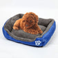 XXL dog kennel mat with grey plush top and blue base, white paw logo