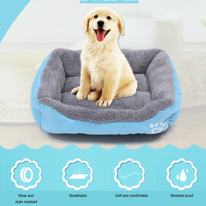 Blue and gray plush dog kennel mat with rounded bolsters and white paw-print badge