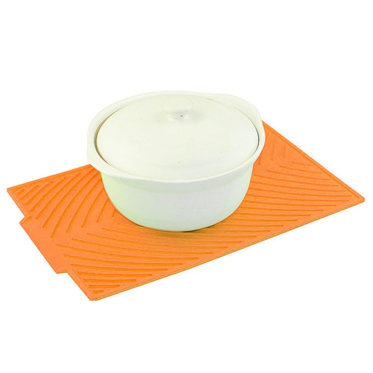 Orange silicone foldable water filter mat with white container on top