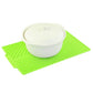 Green silicone foldable water filter mat with white container centerpiece