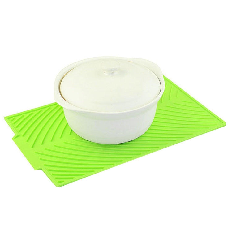 Green silicone foldable water filter mat with white container centerpiece