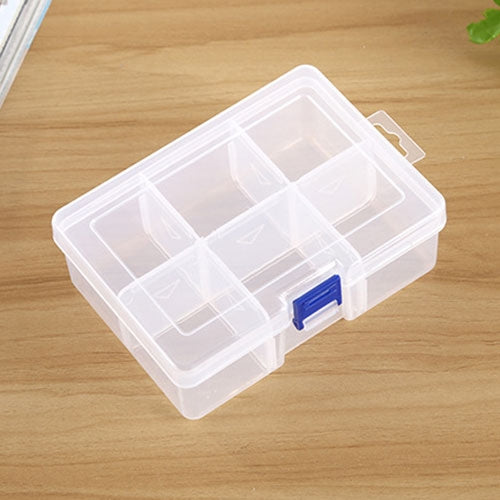 Clear plastic jewelry organizer with 6 divided slots and blue latch, covered lid