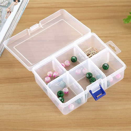 Clear plastic jewelry organizer with open lid, 6 compartments filled with bead jewelry