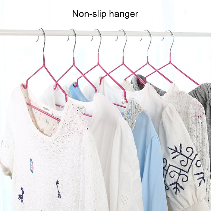 Set of 10 non-slip clothes hangers holding shirts on a rod