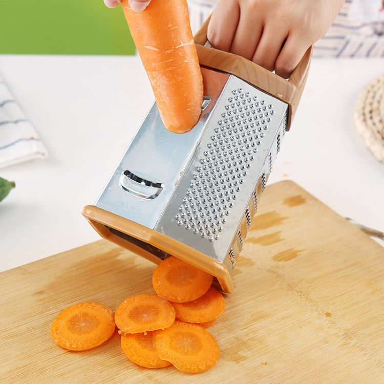 Six-sided vegetable chopper with stainless blades, slicing carrot into round coins