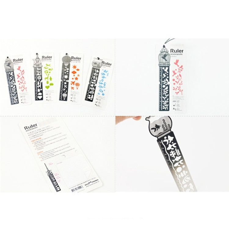 Metal bookmark ruler set with colorful cutout motifs and ruler markings, laid out