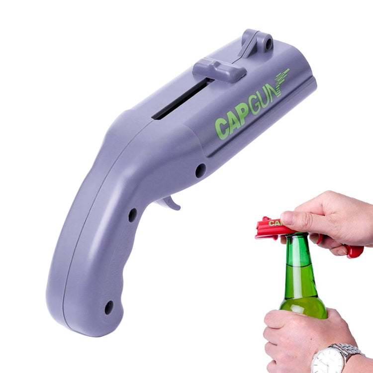 Grey cap gun-style bottle cap opener with top slot and grip trigger, for bar use.