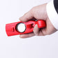 Red cap gun-style bottle cap opener held in hand, showing the circular cap-grip area.