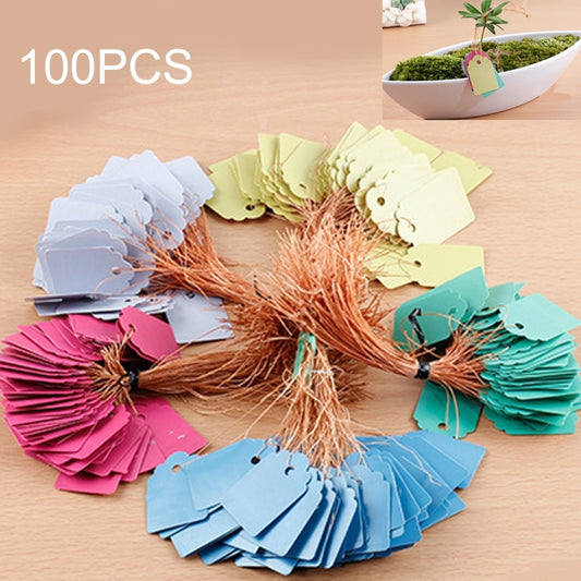 Assorted plastic plant label tags in blue, pink, green, and yellow with hanging hole