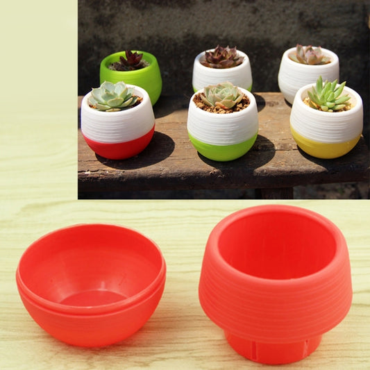 Mini plastic round flower pot with water reservoir, green top and red base
