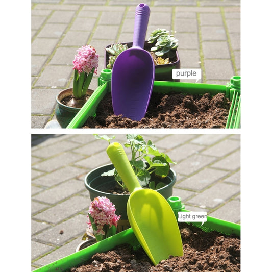 Purple and light green plastic mini soil shovels for potted plants