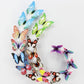 Butterfly fridge magnets arranged in a circular wreath, colorful luminous-style set
