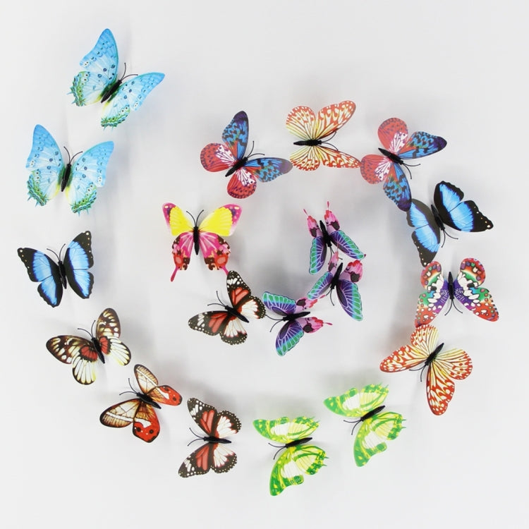 Colorful butterfly fridge magnets forming a large circle arrangement on a sheet