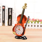 Violin-shaped alarm clock with pen holder, orange-red clock face and side pen slot