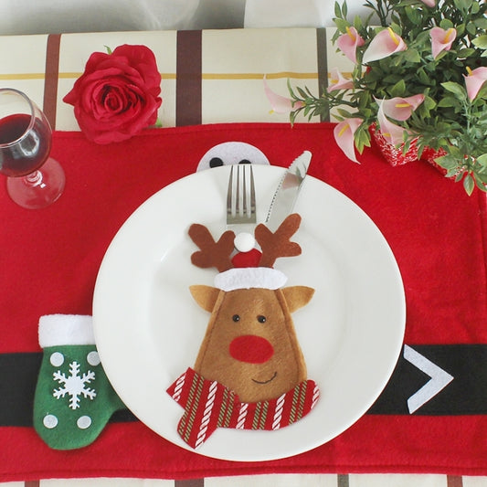 Christmas cartoon reindeer cutlery holder with felt pocket and antlers on plate