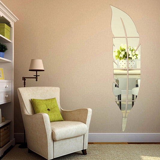 Silver feather-shaped mirror wall sticker on living room wall