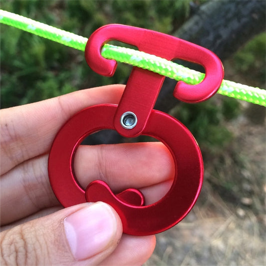 Red aluminum rope hanger hook with green cord, close-up on mounting eye