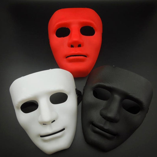 Set of three plastic masquerade face masks: red, white, and black with stylized faces