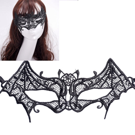 Black lace bat masquerade mask with pointed wings, worn over the eyes