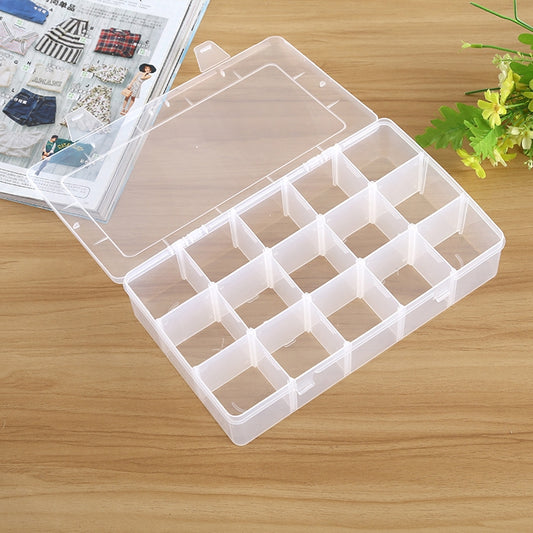 Transparent plastic organizer box with open lid and 15 removable-style grid compartments