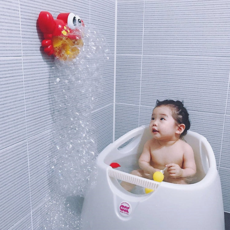 Red crab bubble bath toy in a child bath, blasting bubbles upward