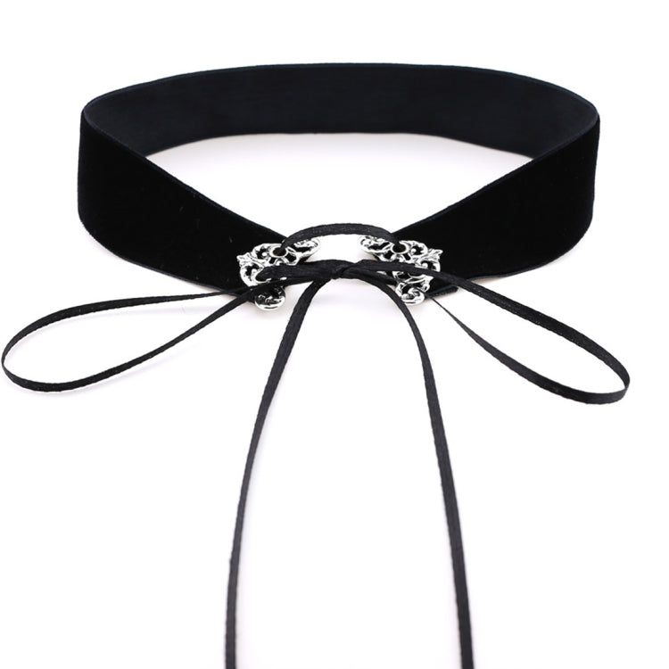 Black velvet choker with ornate silver clasp and long ribbon ties