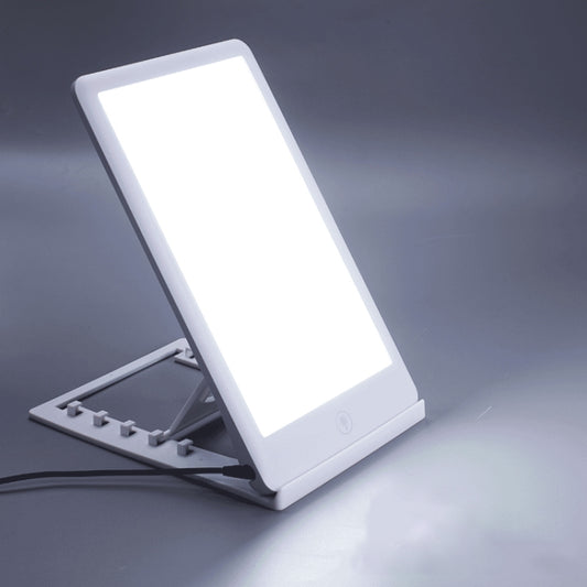 Portable light therapy lamp with white frame and angled glowing panel