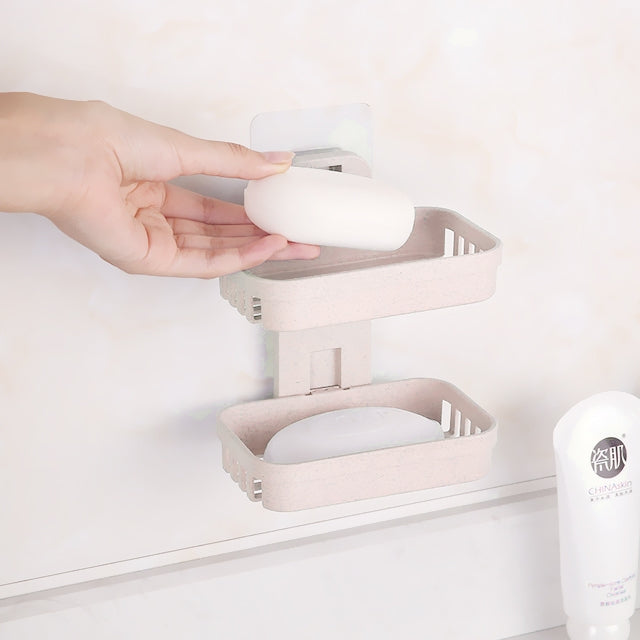 Beige double-deck wall-mounted soap holder with drain slots and gridded trays