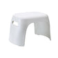 White plastic step stool with side cutout hand grip and contoured seat