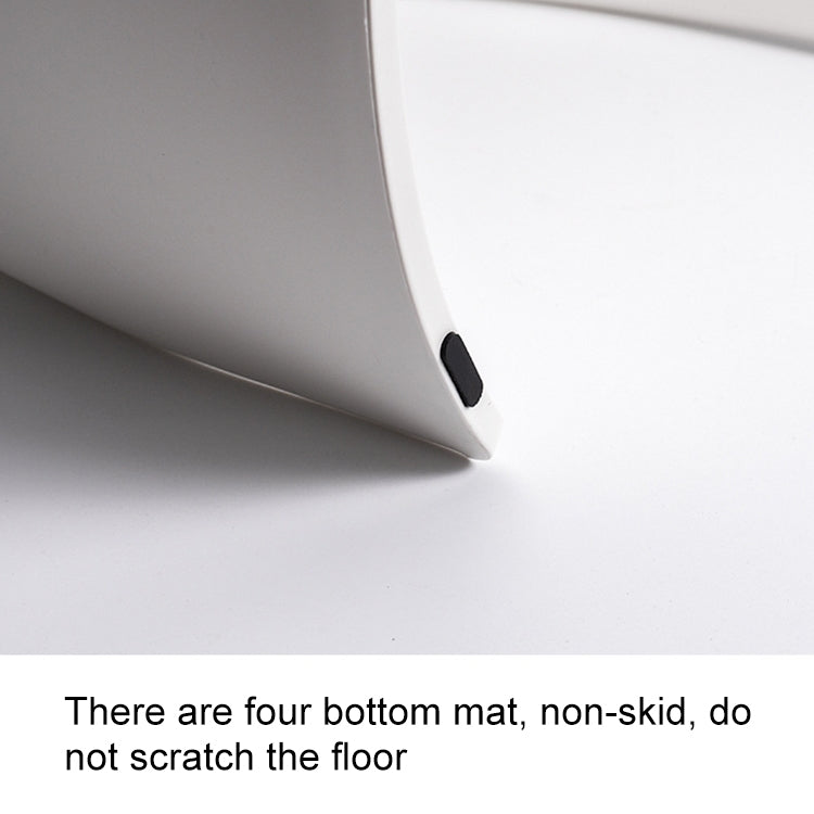 White step stool corner close-up with non-slip pad on the underside